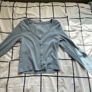 This is an aerie buttoned up long sleeve in a size medium